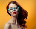 pretty red-haired woman with nude keys red lips glasses luxury