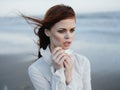 pretty red-haired woman in white dress lifestyle fresh air fashion travel