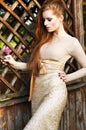 Pretty Redhead Woman in Elegant Dress outdoors