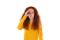 Pretty redhead woman wearing a orange t-shirt standing Royalty Free Stock Photo