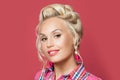 Pretty retro woman with red lips makeup and old-fashioned hairdo smiling. Pin up girl face closeup portrait Royalty Free Stock Photo