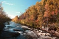 Pretty river in fall with a waterfall in Quebec