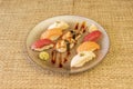 pretty round tray with assorted nigiri sushi of Norwegian salmon, bluefin tuna, butterfish, stewed eel,