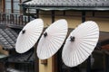 Japanese umbrellas and tiled roofes, Japan Royalty Free Stock Photo