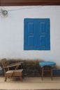 Rustic Scene with Blue Shutters