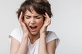 Pretty sad woman posing isolated over white wall background with headache Royalty Free Stock Photo