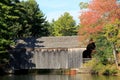 Pretty scene of rustic covered bridge in Fall