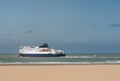 pretty scenery of Calais beach with ferries crossing the English Channel