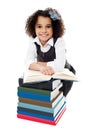 Pretty schoolgirl reading a textbook Royalty Free Stock Photo