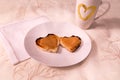 Pretty selective focus flat lay view of breakfast foods with heart shaped toasts covered in peanut butter Royalty Free Stock Photo