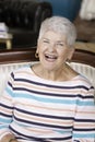 Pretty Senior Woman Laughing in her home