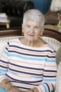 Pretty Senior Woman seated on couch