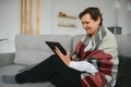 pretty senior woman using tablet computer at home Royalty Free Stock Photo