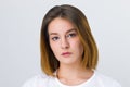 Pretty serious girl teenager in t-shirt poses Royalty Free Stock Photo