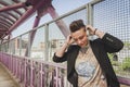 Pretty short hair girl listening to music on a bridge Royalty Free Stock Photo