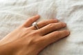 Pretty Silver Diamond Engagement Ring on Hand Royalty Free Stock Photo