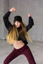 Pretty slim modern style dancer in movement. Royalty Free Stock Photo