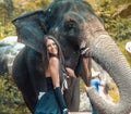Pretty, smailing elephant trainer with her pet Royalty Free Stock Photo