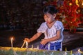 Little girl is burning candles Royalty Free Stock Photo