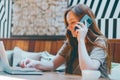 Pretty smiling busy young woman sitting cafe communicating modern devices Royalty Free Stock Photo