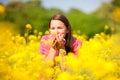 Pretty smiling girl relaxing on green meadow Royalty Free Stock Photo