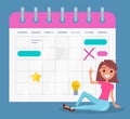 Pretty smiling girl sitting near big calendar, planning events, meetings, organizer or event planner Royalty Free Stock Photo