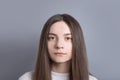 Pretty smiling joyfully female with dark hair, dressed casually, looking with satisfaction at camera, being happy. Studio shot of Royalty Free Stock Photo