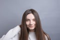 Pretty smiling joyfully female with dark hair, dressed casually, looking with satisfaction at camera, being happy. Studio shot of Royalty Free Stock Photo