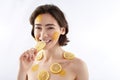 Pretty smiling woman with many lemon pieces