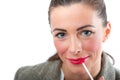 Pretty smiling Woman in suit applying makeup