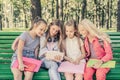 Pretty smilng little girls sitting together