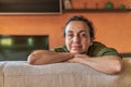 Pretty Spanish woman with glasses at home in front of the camera