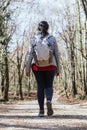 Pretty spanish woman walking in the forest