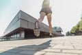 Pretty sporty woman jogging at city