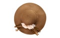 Pretty straw hat with ribbon and bow on white background. Beach hat top view isolated Royalty Free Stock Photo