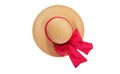 Pretty straw hat with ribbon and bow on white background. Beach hat top view isolated Royalty Free Stock Photo