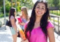 Pretty student girl with some friends after school Royalty Free Stock Photo