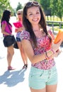 Pretty student girl with some friends after school Royalty Free Stock Photo