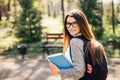 Pretty student smiling at camera outside on campus at the university Royalty Free Stock Photo