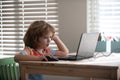 Pretty stylish schoolkid studying homework math during lesson at classroom, education concept, Cute schooler. Royalty Free Stock Photo