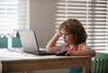 Pretty stylish schoolkid studying homework math during lesson at classroom, education concept, Cute schooler. Royalty Free Stock Photo