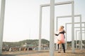 Pretty sunny outdoor portrait of young stylish couple while kissing on the roof with city view Royalty Free Stock Photo