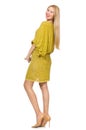 Pretty tall woman in yellow dress isolated on