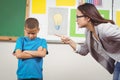 Pretty teacher reprimanding a pupil