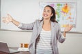 Pretty teacher teaching in a classroom