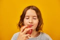 Pretty teen girl, child eat, bites a fresh red apple Royalty Free Stock Photo