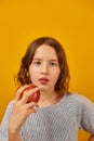 Pretty teen girl, child eat, bites a fresh red apple Royalty Free Stock Photo