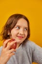 Pretty teen girl, child eat, bites a fresh red apple Royalty Free Stock Photo