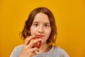 Pretty teen girl, child eat, bites a fresh red apple Royalty Free Stock Photo