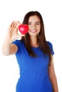 Pretty teen girl showing red heart. Royalty Free Stock Photo